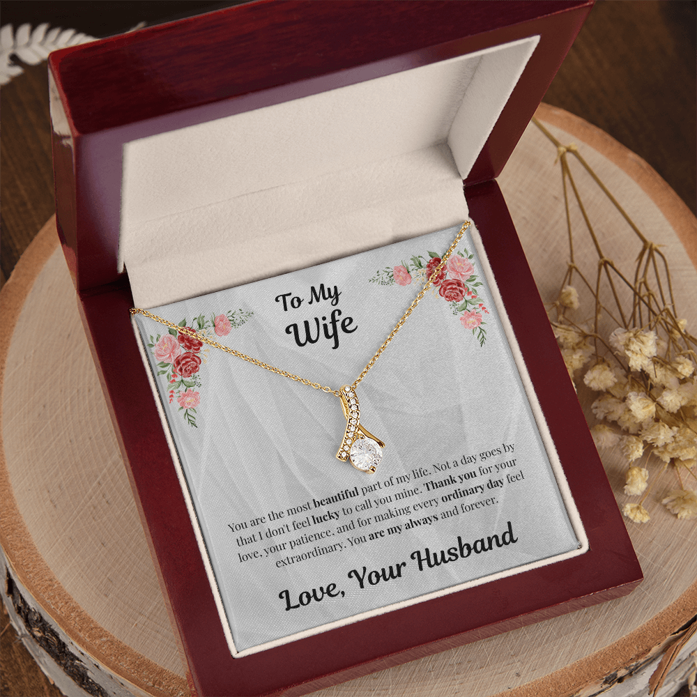 18K yellow gold-finish Alluring Beauty Necklace in angled mahogany gift box on wooden display