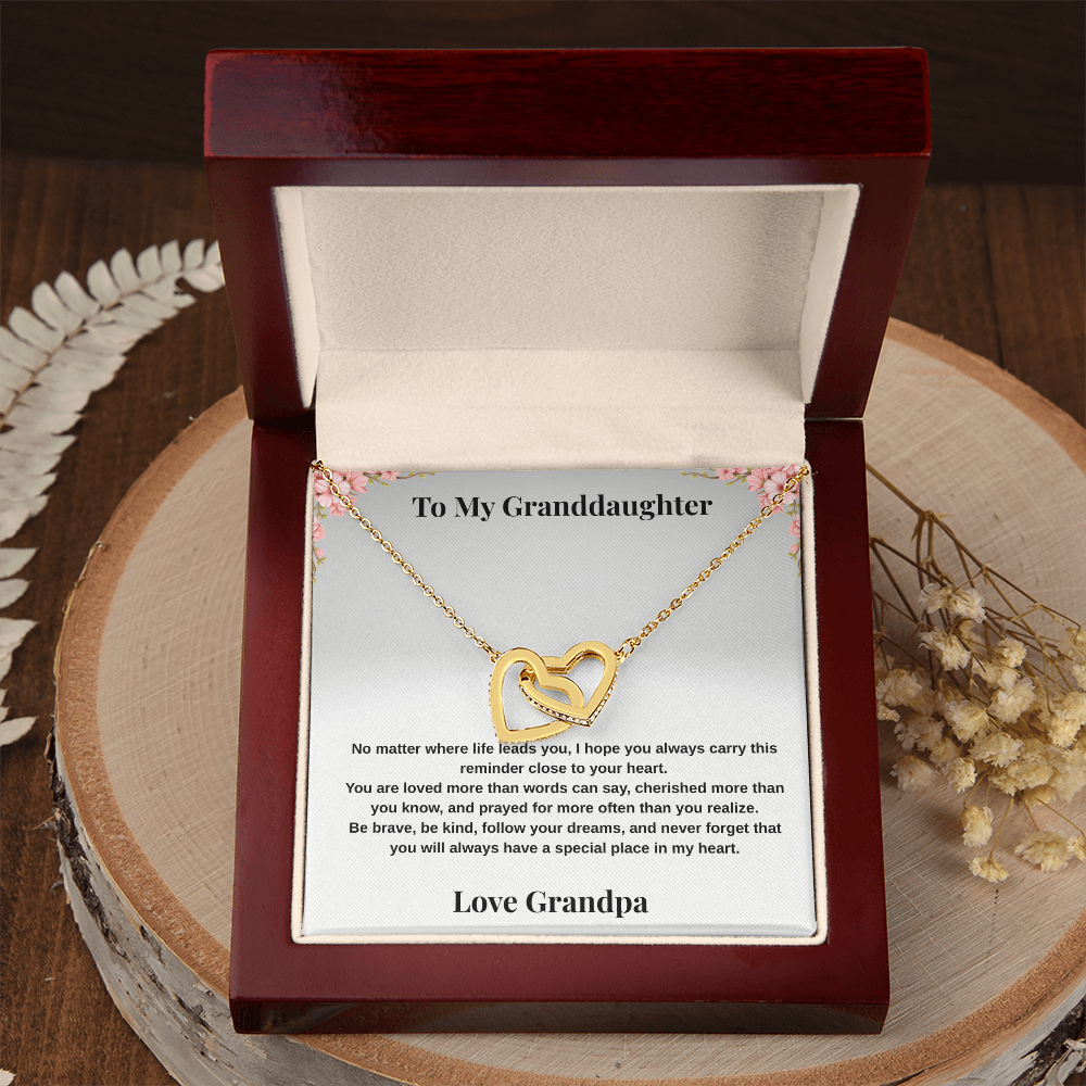18k yellow gold-finish Interlocking Hearts Necklace in open mahogany-style luxury box with To My Granddaughter message card from Grandpa on rustic wood display