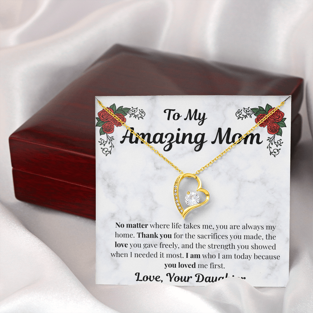 18k yellow gold-finish Forever Love Necklace beside closed mahogany gift box