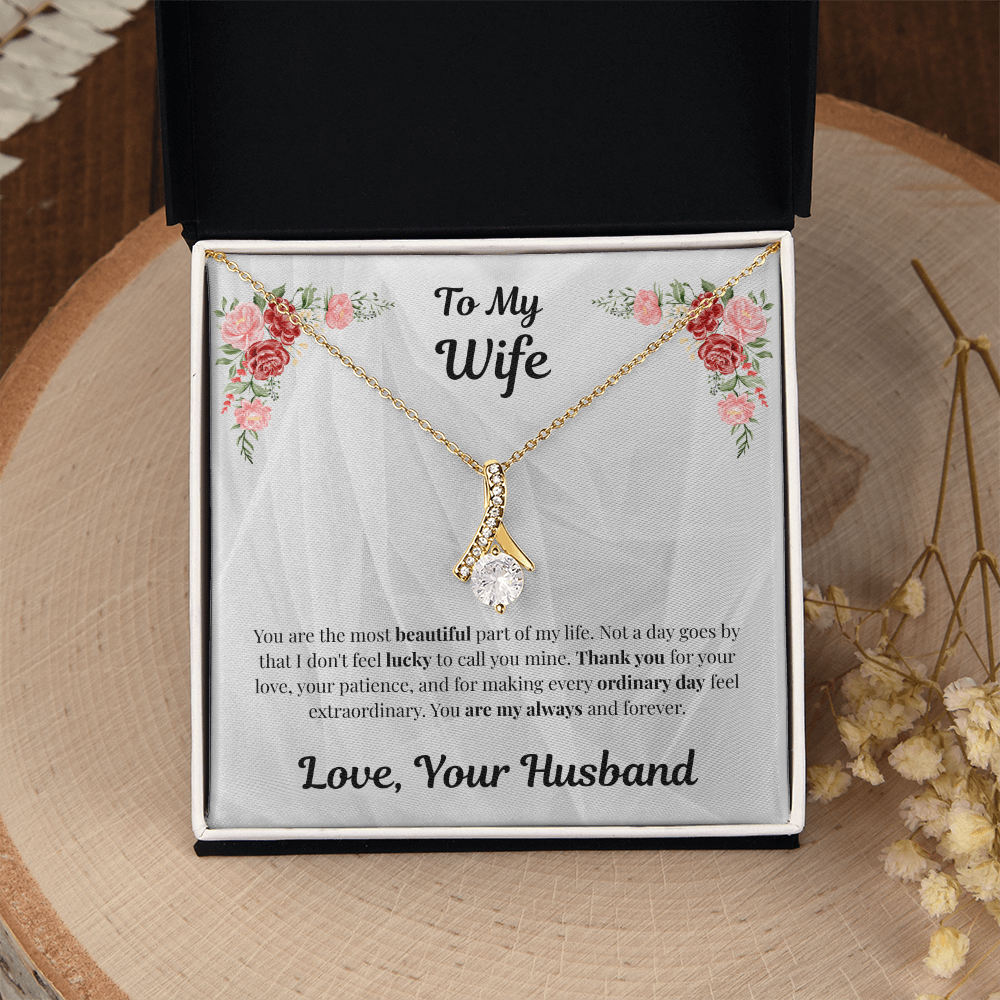 18K yellow gold-finish Alluring Beauty Necklace in standard gift box on wooden display