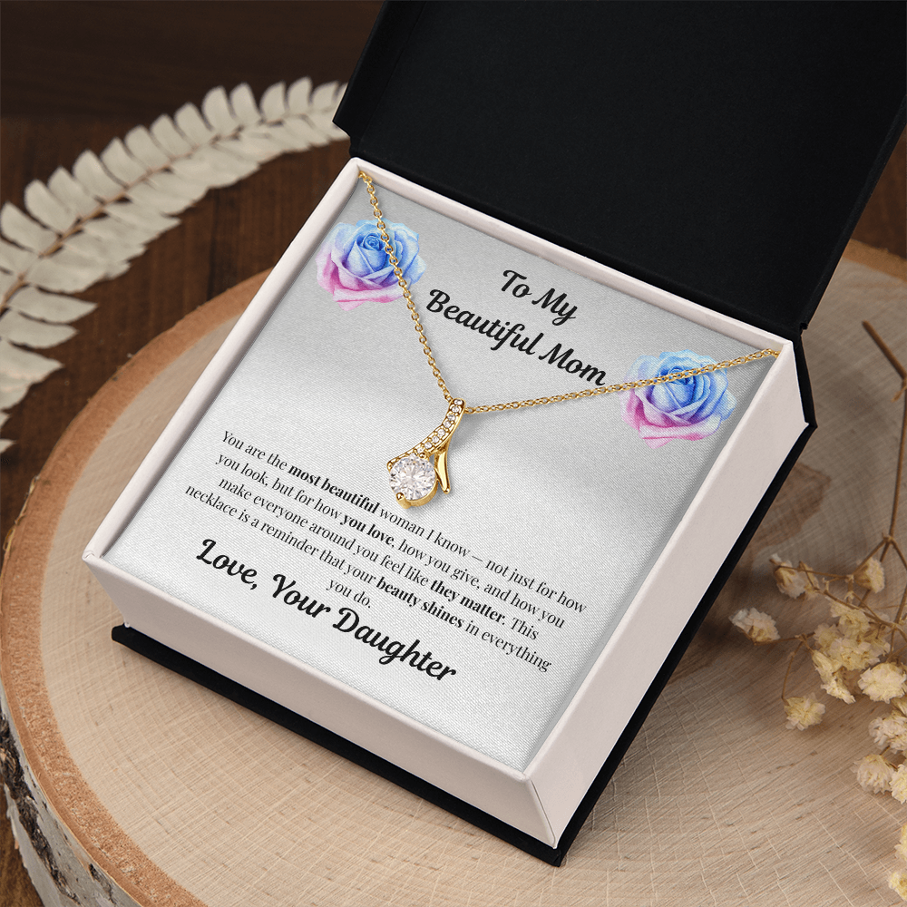 18K yellow gold-finish Alluring Beauty Necklace in standard gift box on wooden tray