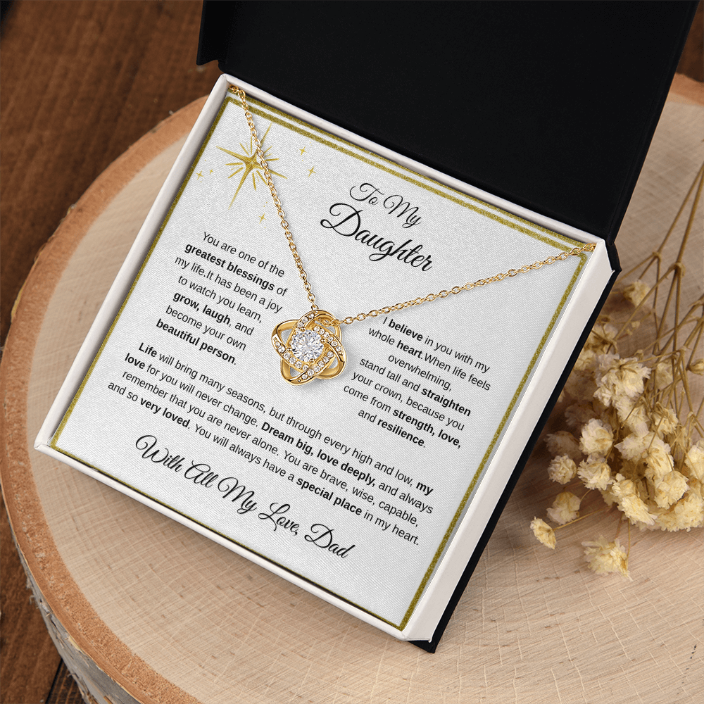 18K yellow gold-finish Love Knot Necklace in standard gift box on wooden display