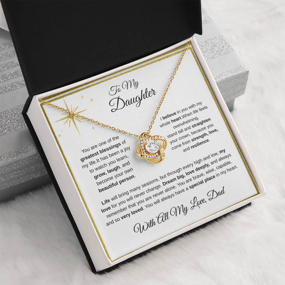 18K yellow gold-finish Love Knot Necklace in standard gift box on white fabric