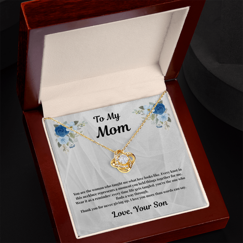 18K yellow gold-finish Love Knot Necklace in angled mahogany gift box
