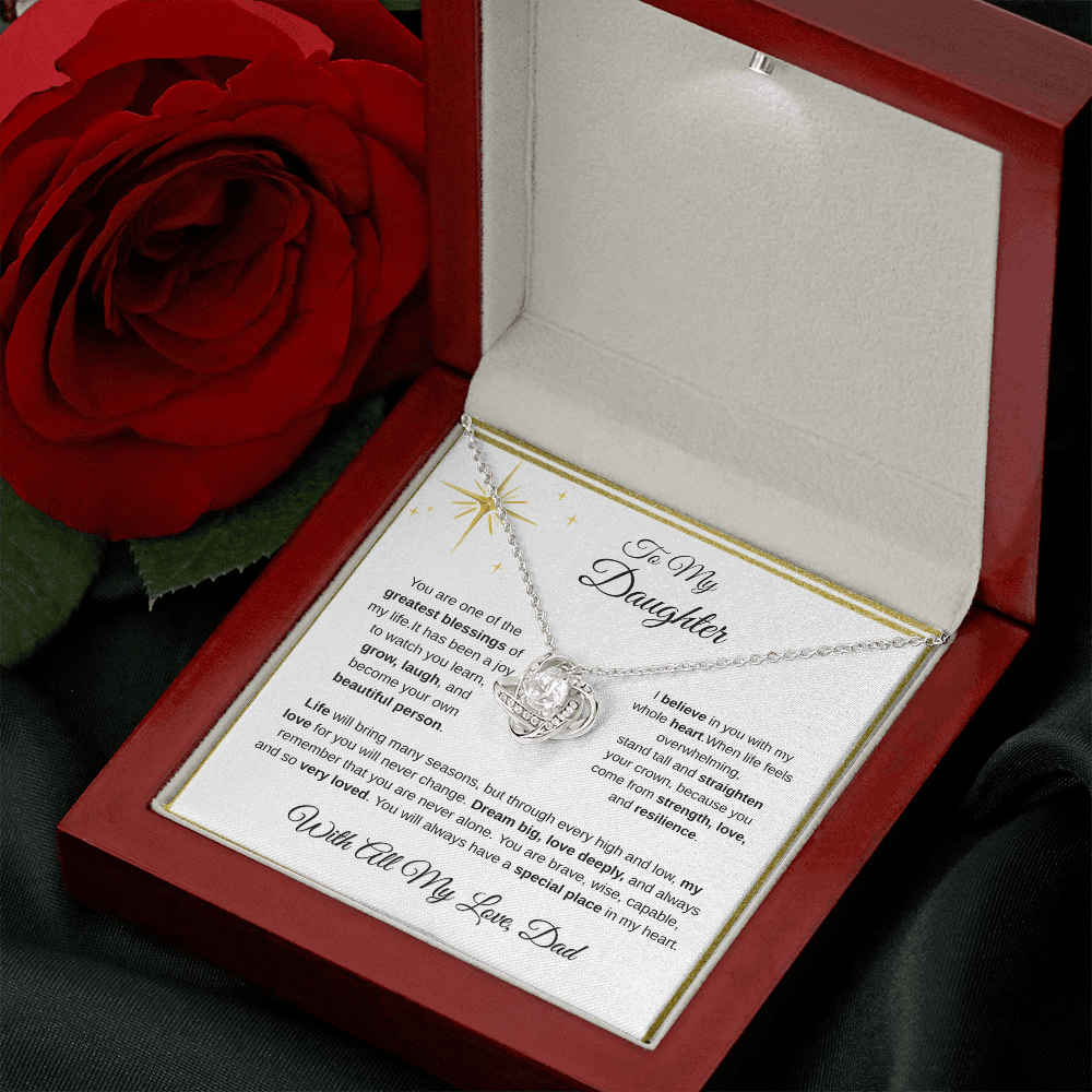 14K white gold-finish Love Knot Necklace in mahogany gift box beside red rose
