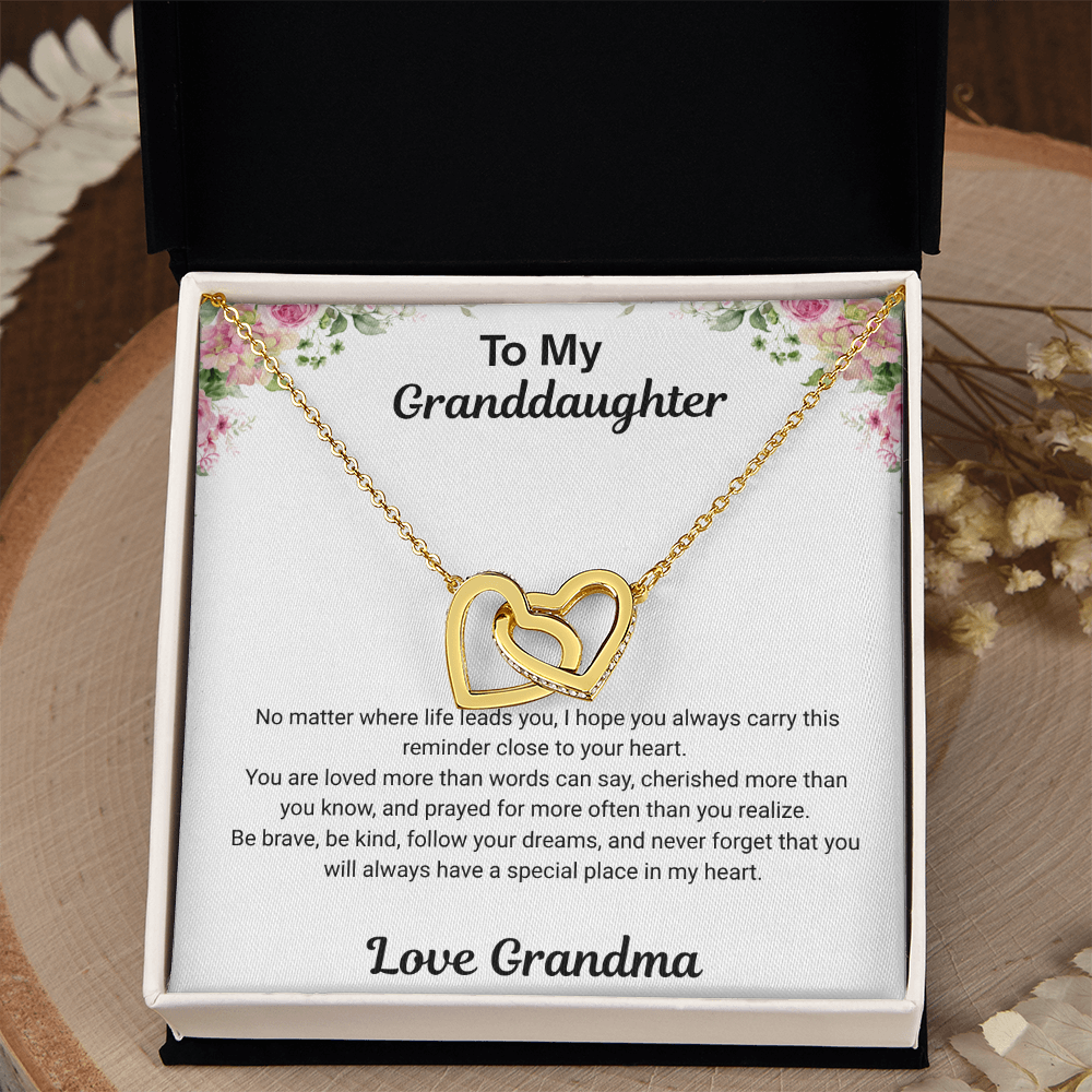 18k yellow gold-finish Interlocking Hearts Necklace in standard gift box with To My Granddaughter message card from Grandma on rustic wood display
