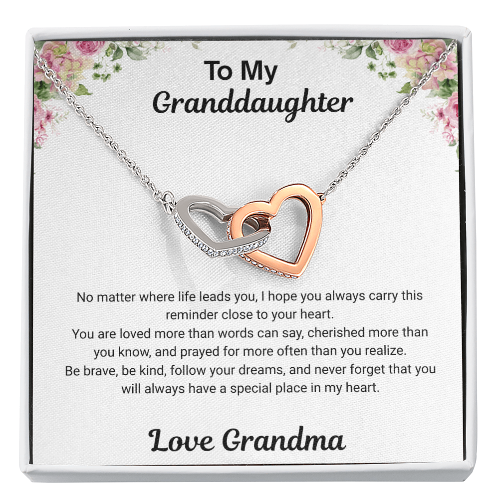 Close-up of 14k white gold-finish Interlocking Hearts Necklace with cubic zirconia accents on To My Granddaughter message card from Grandma