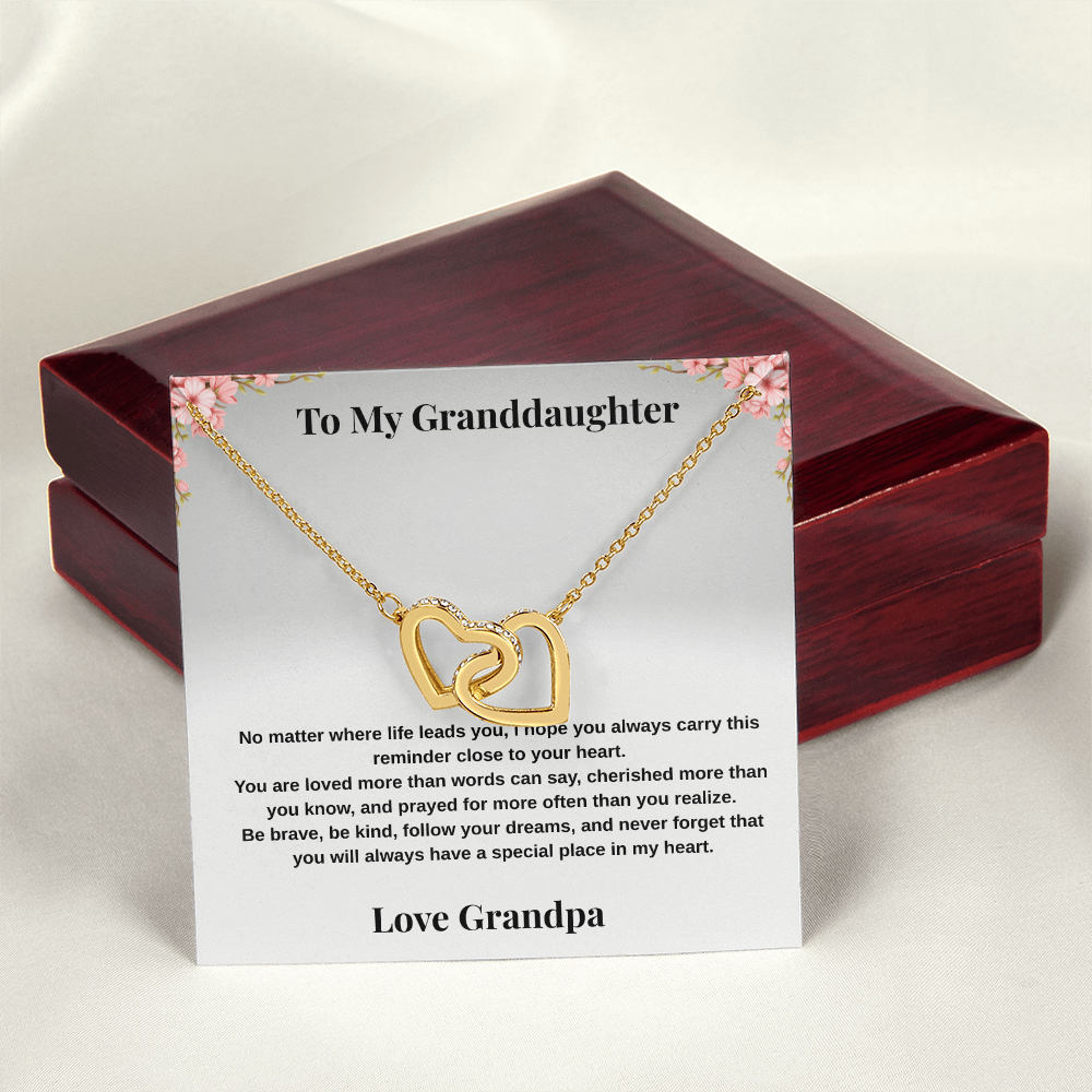 18k yellow gold-finish Interlocking Hearts Necklace on To My Granddaughter message card from Grandpa displayed in front of mahogany-style luxury box