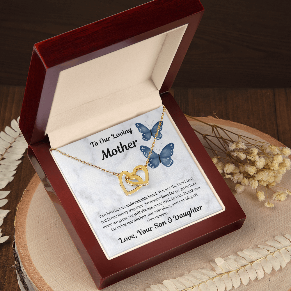 18K yellow gold-finish Interlocking Hearts Necklace in angled mahogany gift box on wooden tray