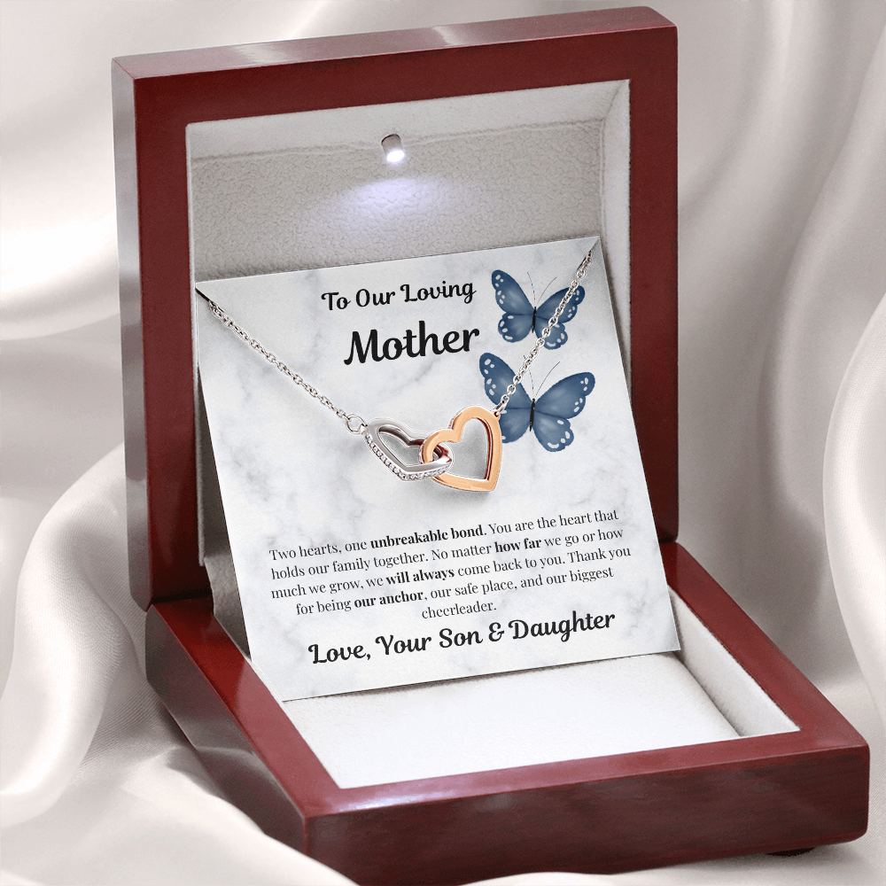 14k white gold-finish Interlocking Hearts Necklace in illuminated mahogany gift box on white fabric