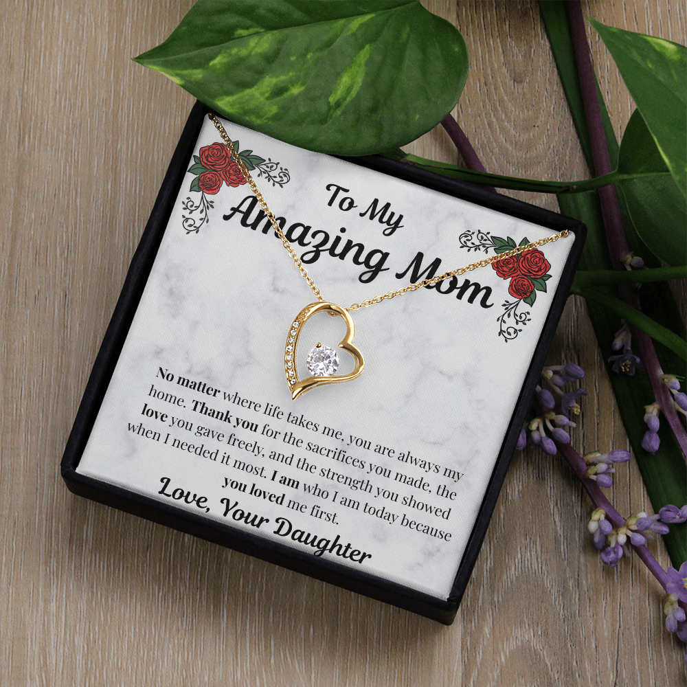 18k yellow gold-finish Forever Love Necklace in standard gift box beside greenery